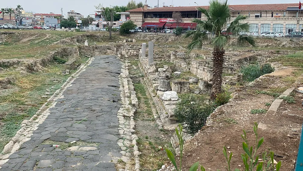 An excavated Roman street of black basalt paving